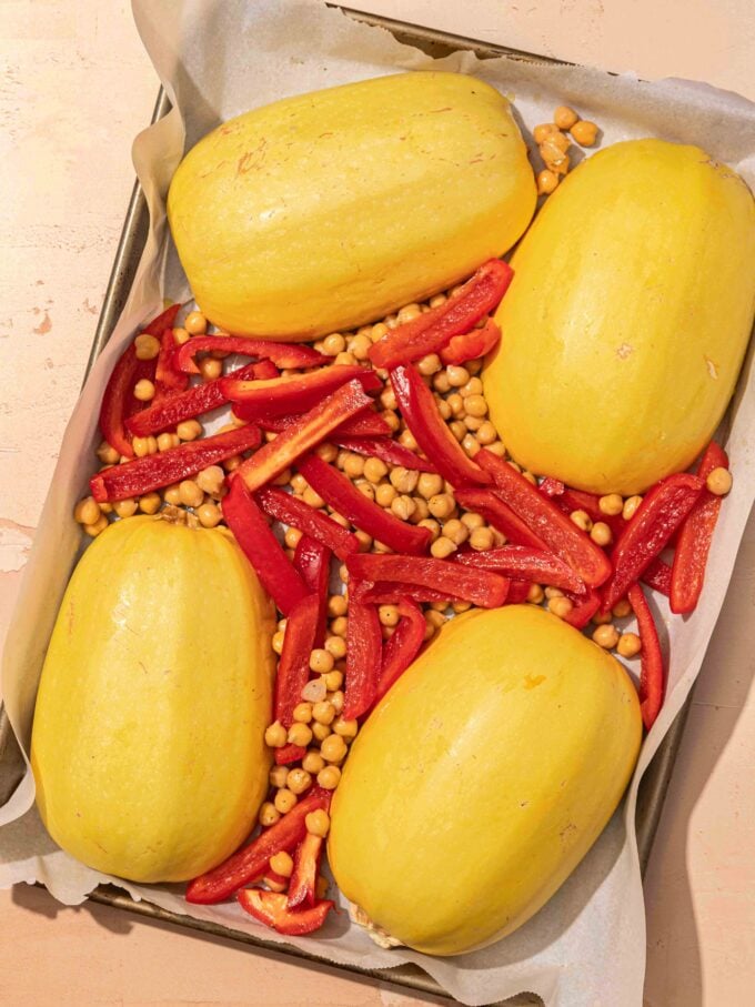 spaghetti squash, chickpeas and peppers on pan