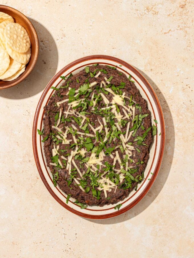 black bean dip with cheese and crackers