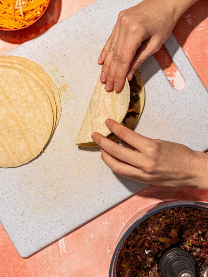 hand folding tortilla