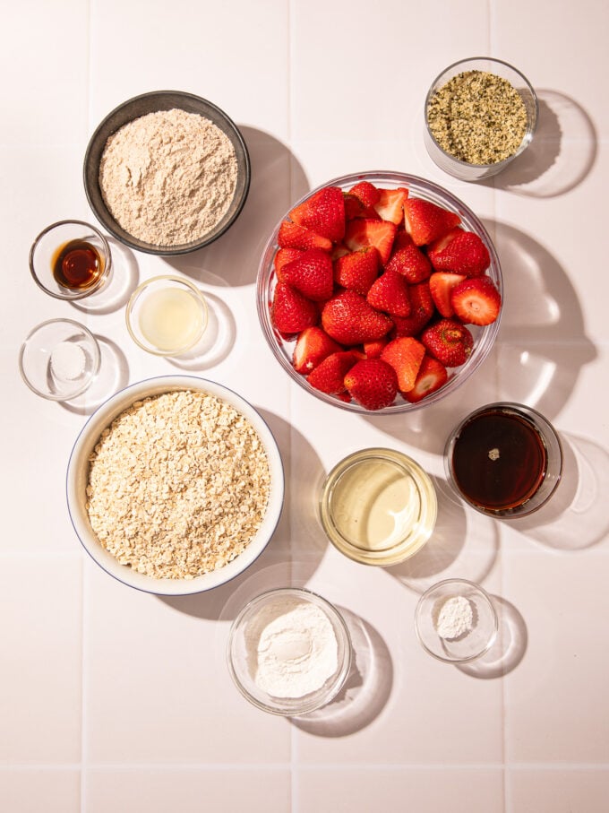 fresh strawberries, oats and flour in bowls