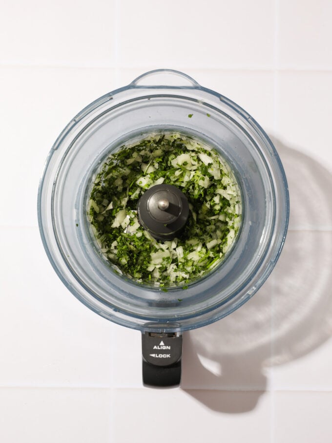 minced herbs and onion in food processor