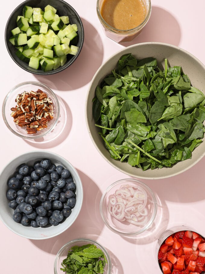 spinach, blueberries, cucumber in bowls