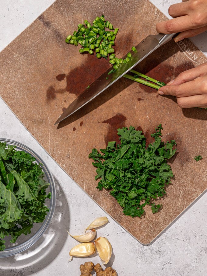 hand chopping kale stems