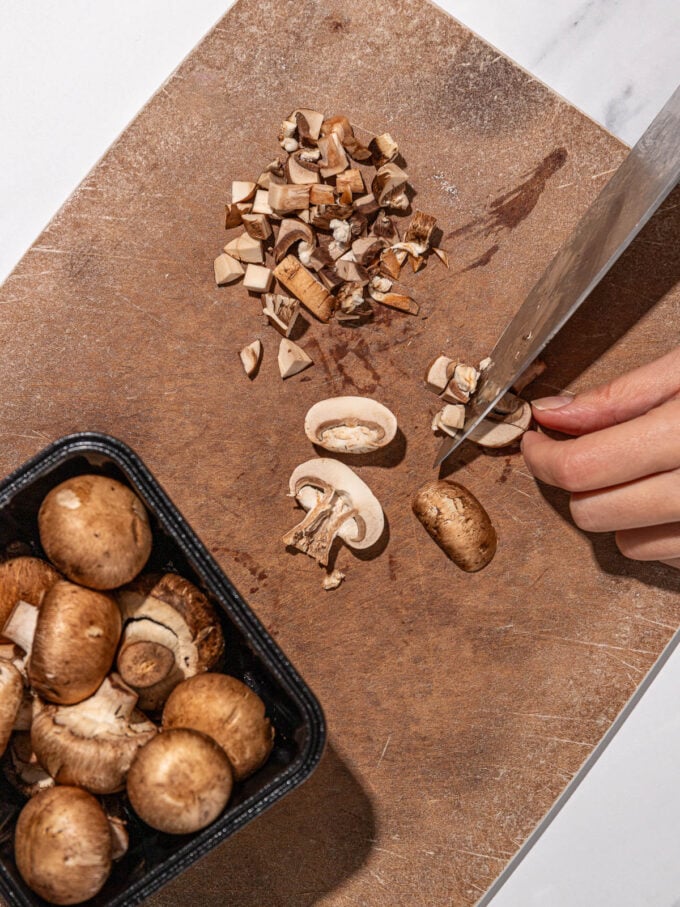 hand slicing mushrooms 