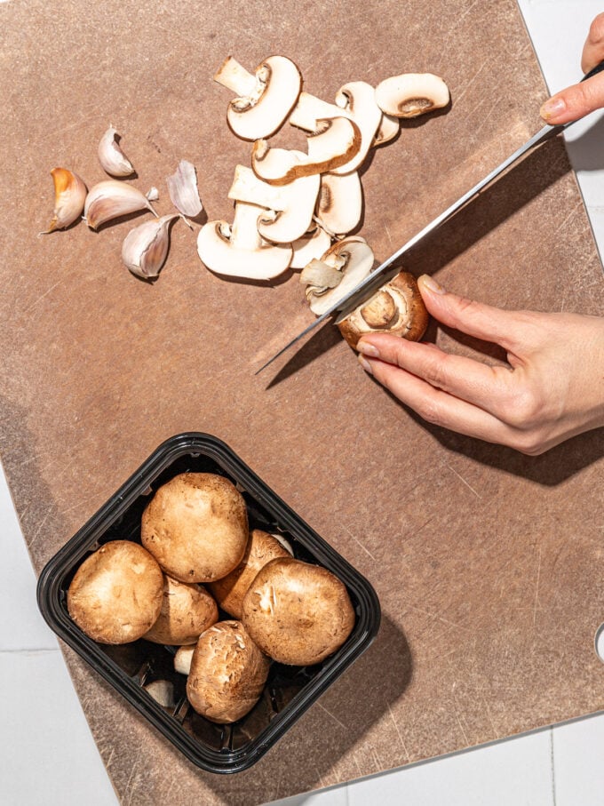 hand slicing mushrooms