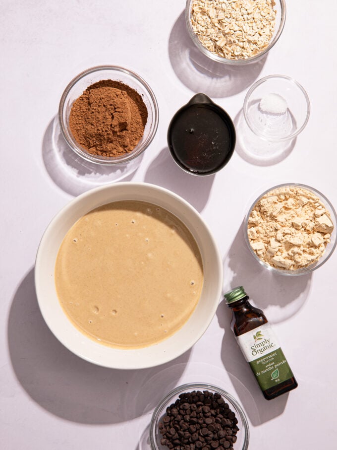 tahini, oats, protein powder and cocoa in bowls