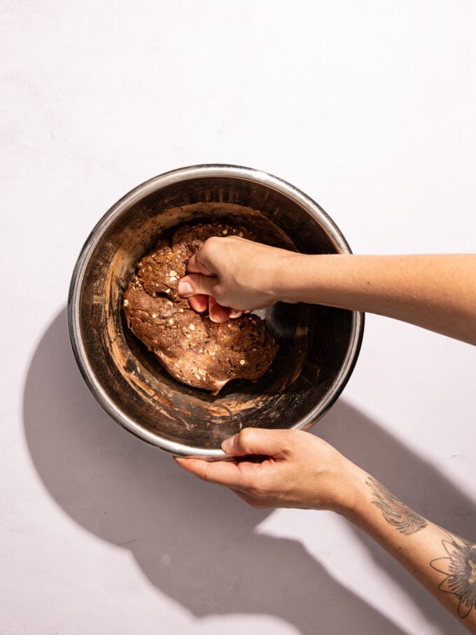 hand mixing chocolate dough