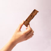 hand holding chocolate protein bar