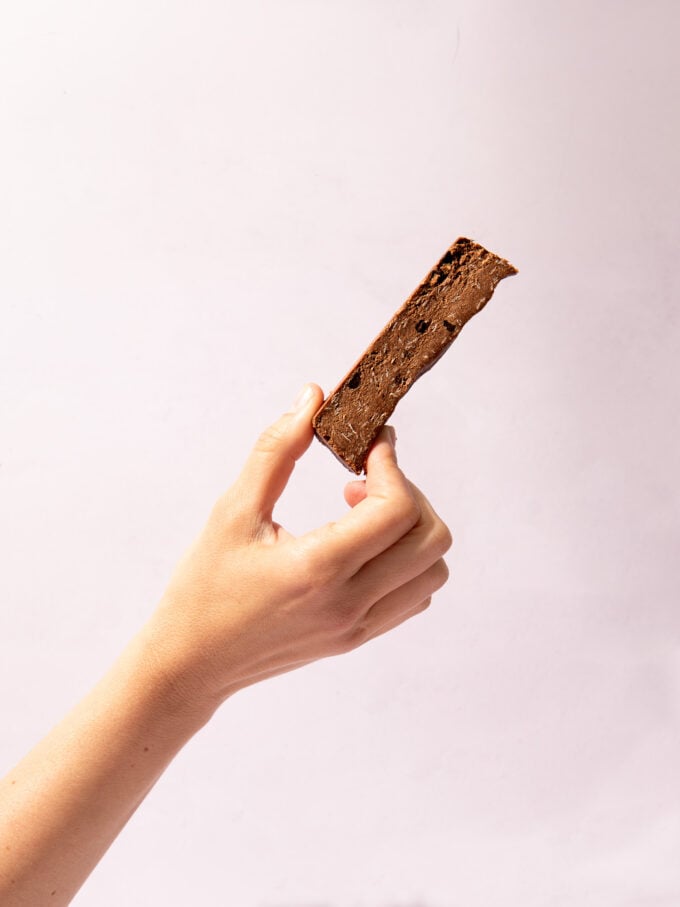 hand holding chocolate protein bar