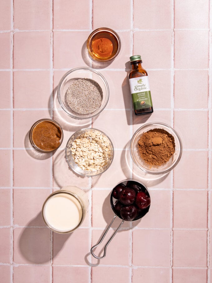 cherries, cocoa, oats, chia seeds in bowls