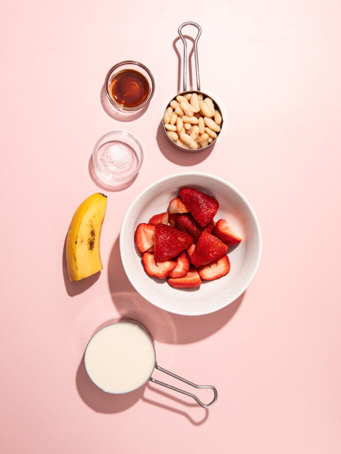 strawberries in white bowl, white beans and banana