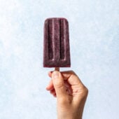 hand holding blueberry popsicle