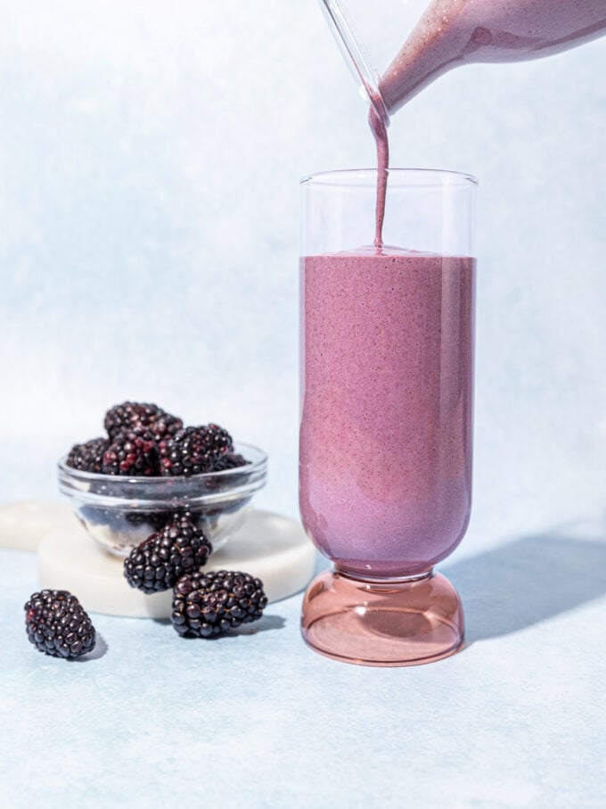 blackberries with a glass of blackberry smoothie