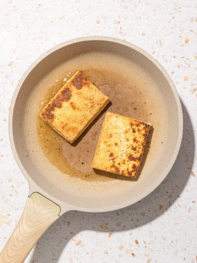 fried tofu in beige skillet