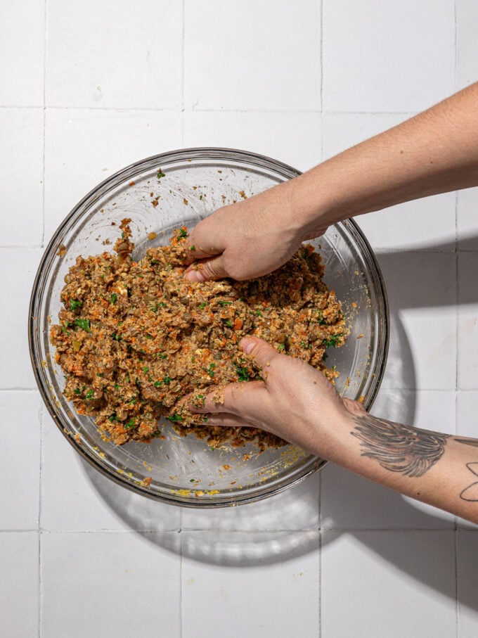 hands mixing vegan meatloaf dough