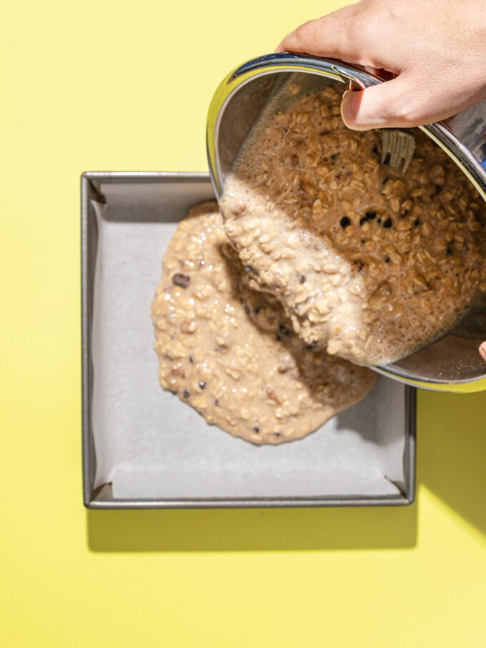 pouring oatmeal mixture into baking dish